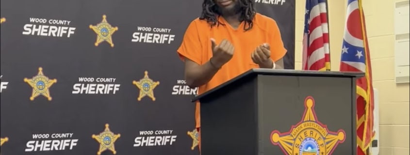 Fostoria News Woman speaking at a podium during a sheriff's event in Fostoria.